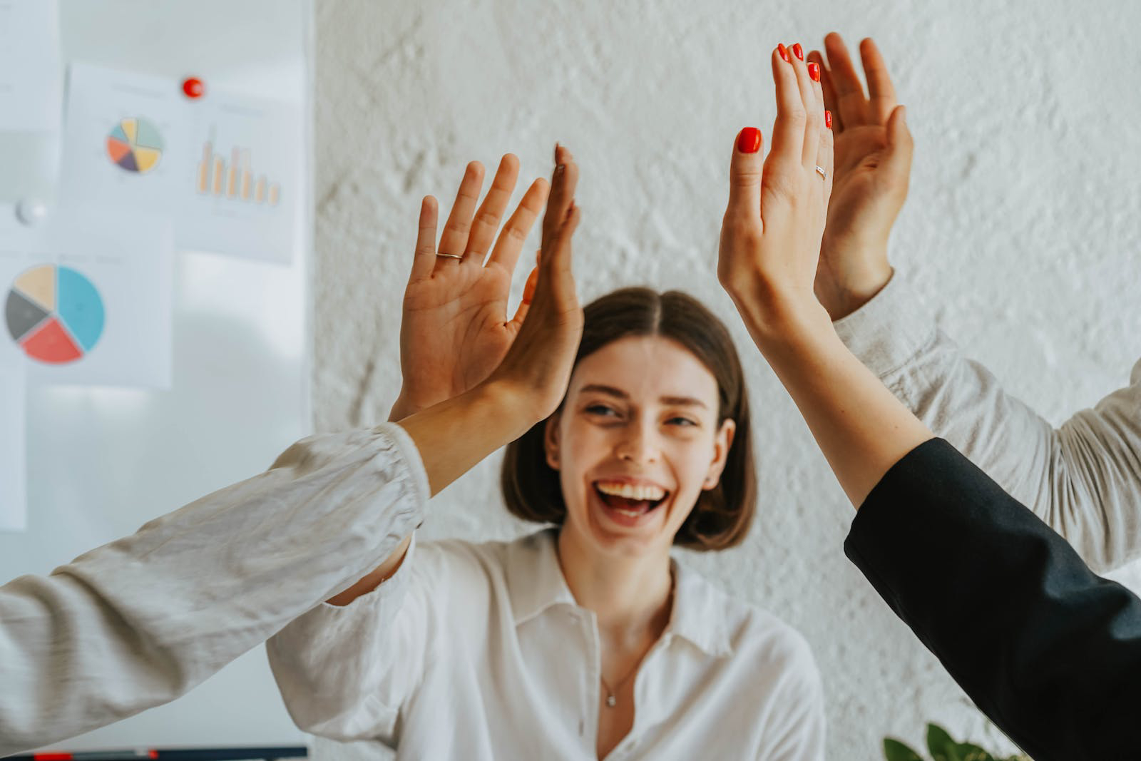 People high-fiving
